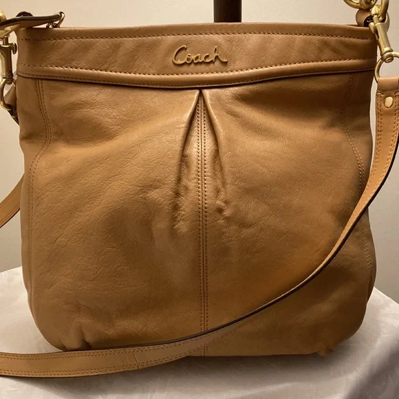 This is a coach leather bag with a shoulder strap and a carry handle - Picture 5 of 6